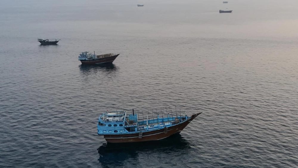 This aerial photograph shows boats anchored off Oman’s northern Musandam Peninsula near the Strait of Hormuz on June 27, 2026. (AFP)
