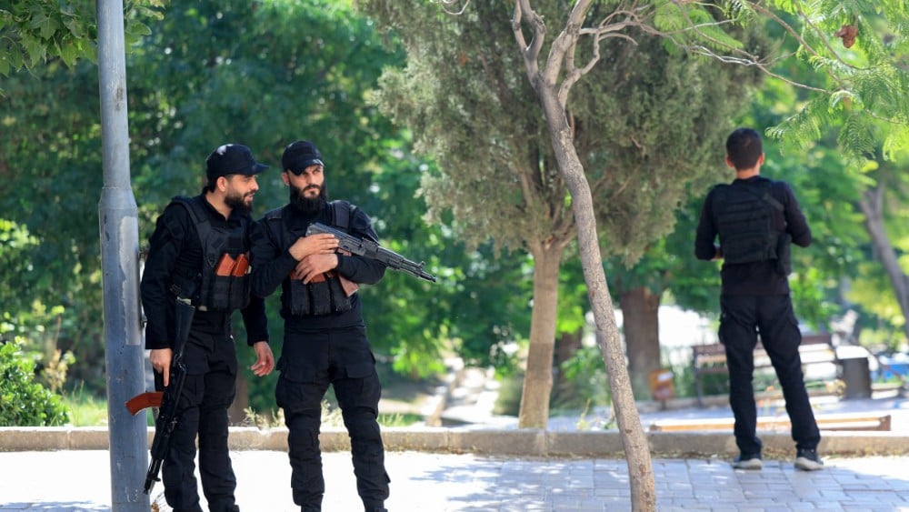 Syrian security forces patrol near France's President's hotel during his visit to Damascus on July 7, 2026. (Photo: AFP)