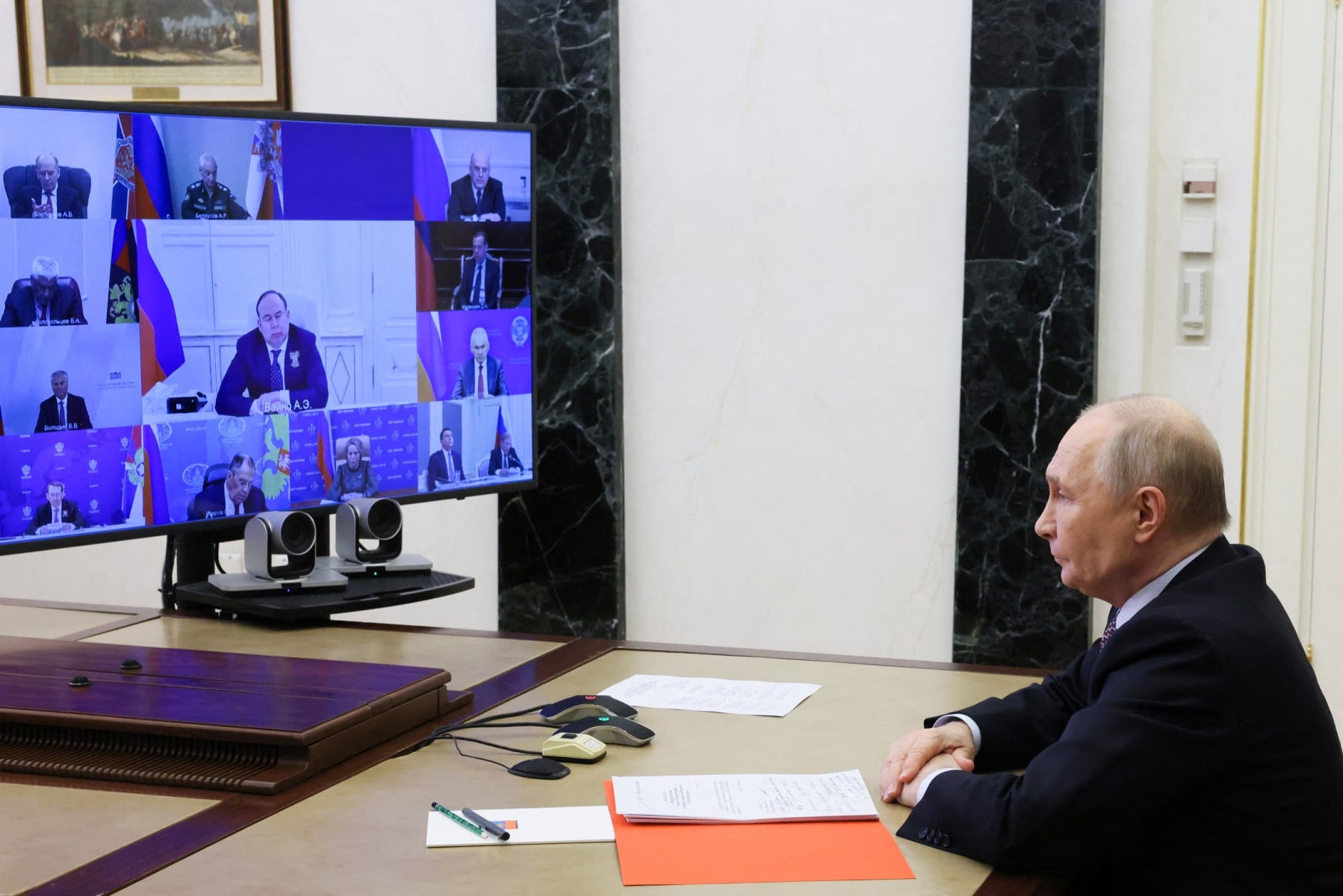 In this pool photograph distributed by the Russian state agency Sputnik, Russia's President Vladimir Putin chairs a Security Council meeting via videolink in Moscow on May 8, 2026. (Photo by Mikhail METZEL / POOL / AFP)