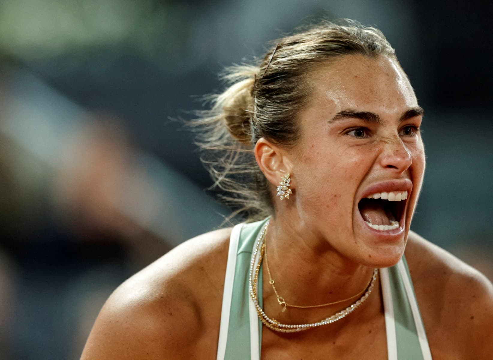 Belarus' Aryna Sabalenka reacts after winning a point to US' Hailey Baptiste during their 2026 WTA Tour Madrid Open tennis tournament singles match at the Caja Magica in Madrid, on April 28, 2026. (AFP)
