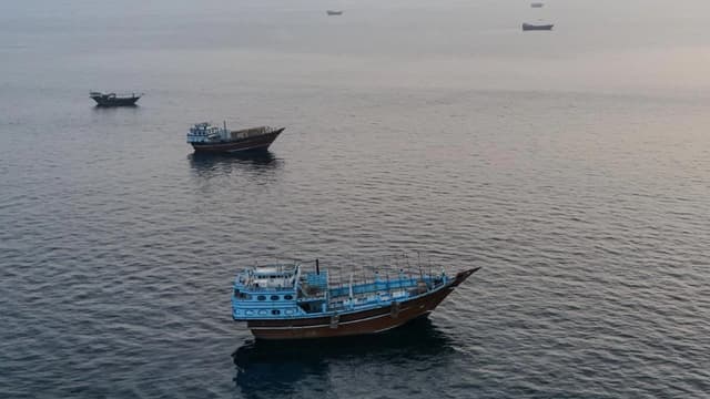 This aerial photograph shows boats anchored off Oman’s northern Musandam Peninsula near the Strait of Hormuz on June 27, 2026. (AFP)