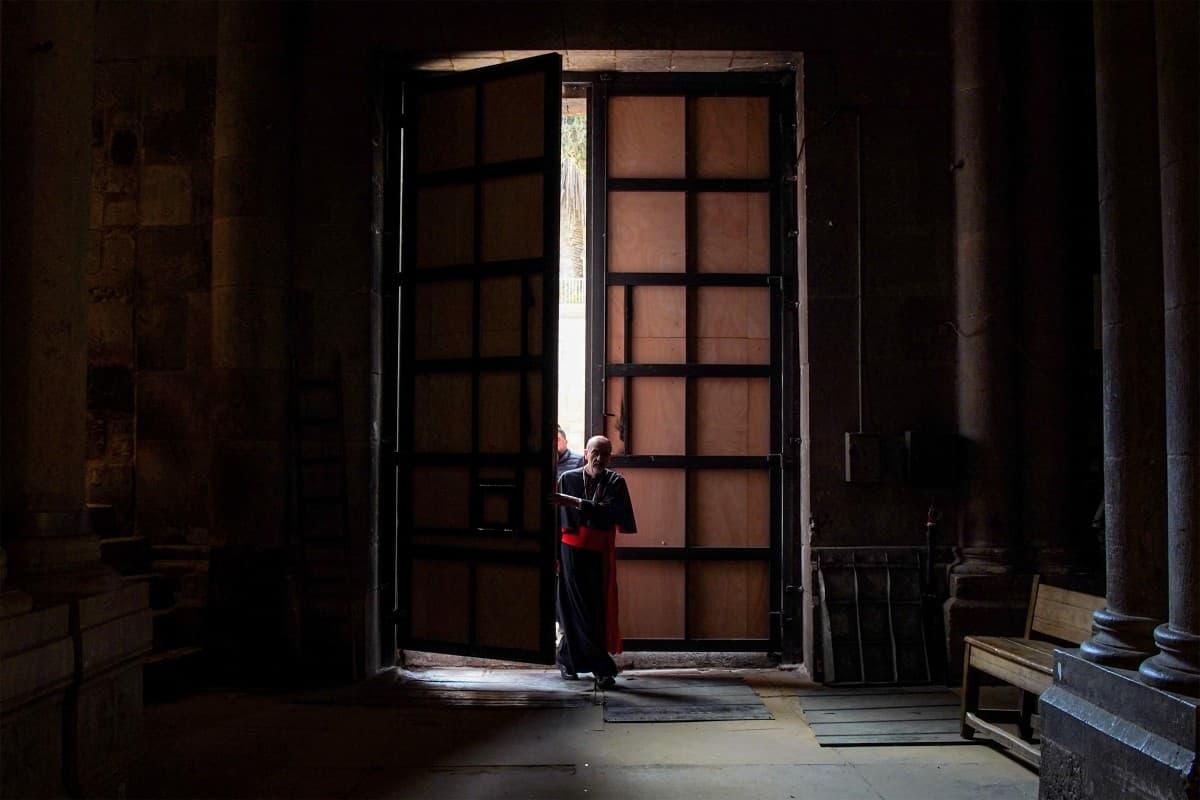 In this handout picture released by the Latin Patriarchate of Jerusalem media office, Cardinal Pizzaballa, Latin Patriarch of Jerusalem, enters the Church of the Holy Sepulchre in the old city of Jerusalem on April 5, 2025 to lead Easter Sunday Mass. (AFP