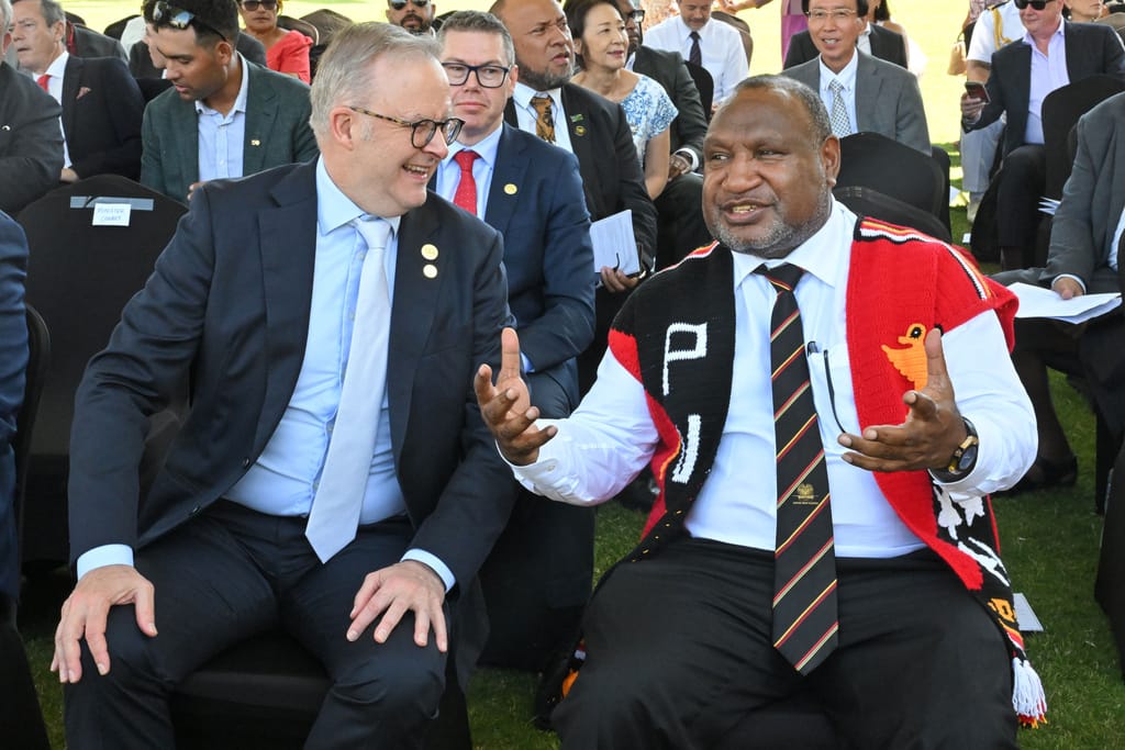 Anthony Albanese, left, and James Marape