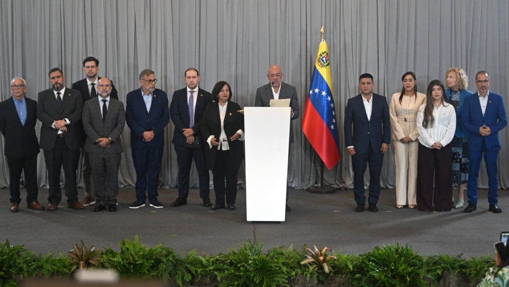 Venezuela's National Assembly President Jorge Rodriguez (C) reads a statement after a meeting with opposition representatives in Caracas on August 12, 2026. (Photo: AFP)