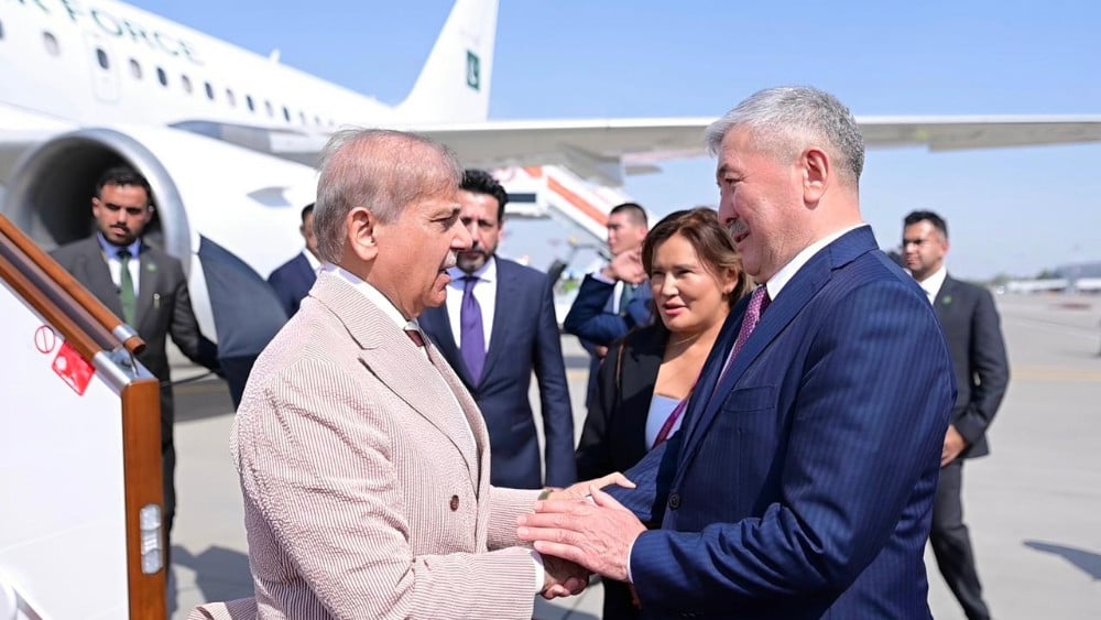 Chairman of the Cabinet of Ministers of Kyrgyzstan Adylbek Kasymaliev welcomes Pakistan Prime Minister Shehbaz Sharif upon his arrival at Manas International Airport in Bishkek, Kyrgyzstan on August 31, 2026. (PMO)