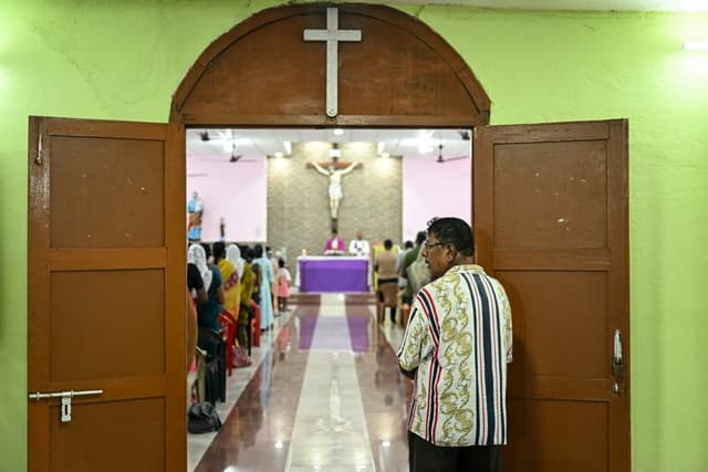 Christian devotees attend mass at St. Joseph Catholic Church near Campbell Bay on Great Nicobar Island on March 27, 2026. (Photo: AFP/File)