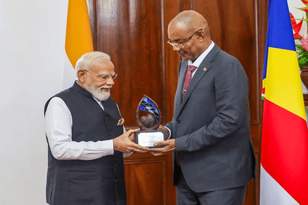 Indian Prime Minister Narendra Modi accepts the "Guardian of the Blue Horizon" medal from Seychelles President Patrick Herminie during an official presentation ceremony at the State House in Victoria, Sunday, June 28, 2026. (News On Air)
