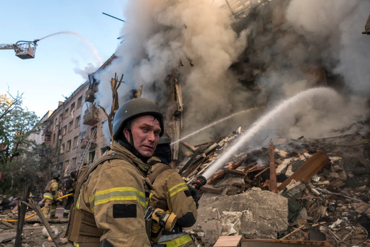 Firefighters work to extinguish a fire at the site of a heavily damaged building following Russian strikes to the Ukrainian capital in Kyiv on May 24, 2026, amid the Russian invasion of Ukraine. (Photo: AFP)