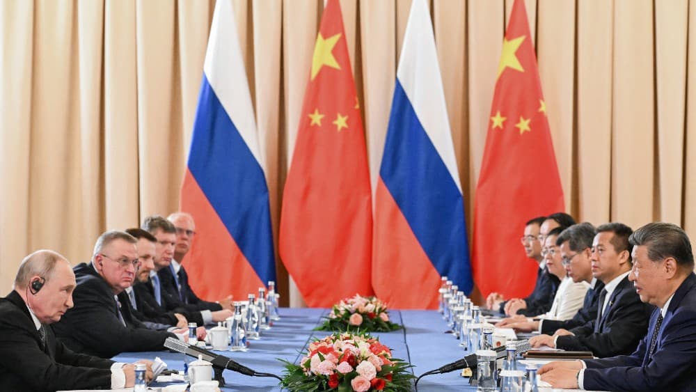 In this pool photograph distributed by the Russian state agency Sputnik, Russia's President Vladimir Putin and China's President Xi Jinping hold a meeting on the sidelines of the Shanghai Cooperation Organisation (SCO) summit in Bishkek on August 31, 2026