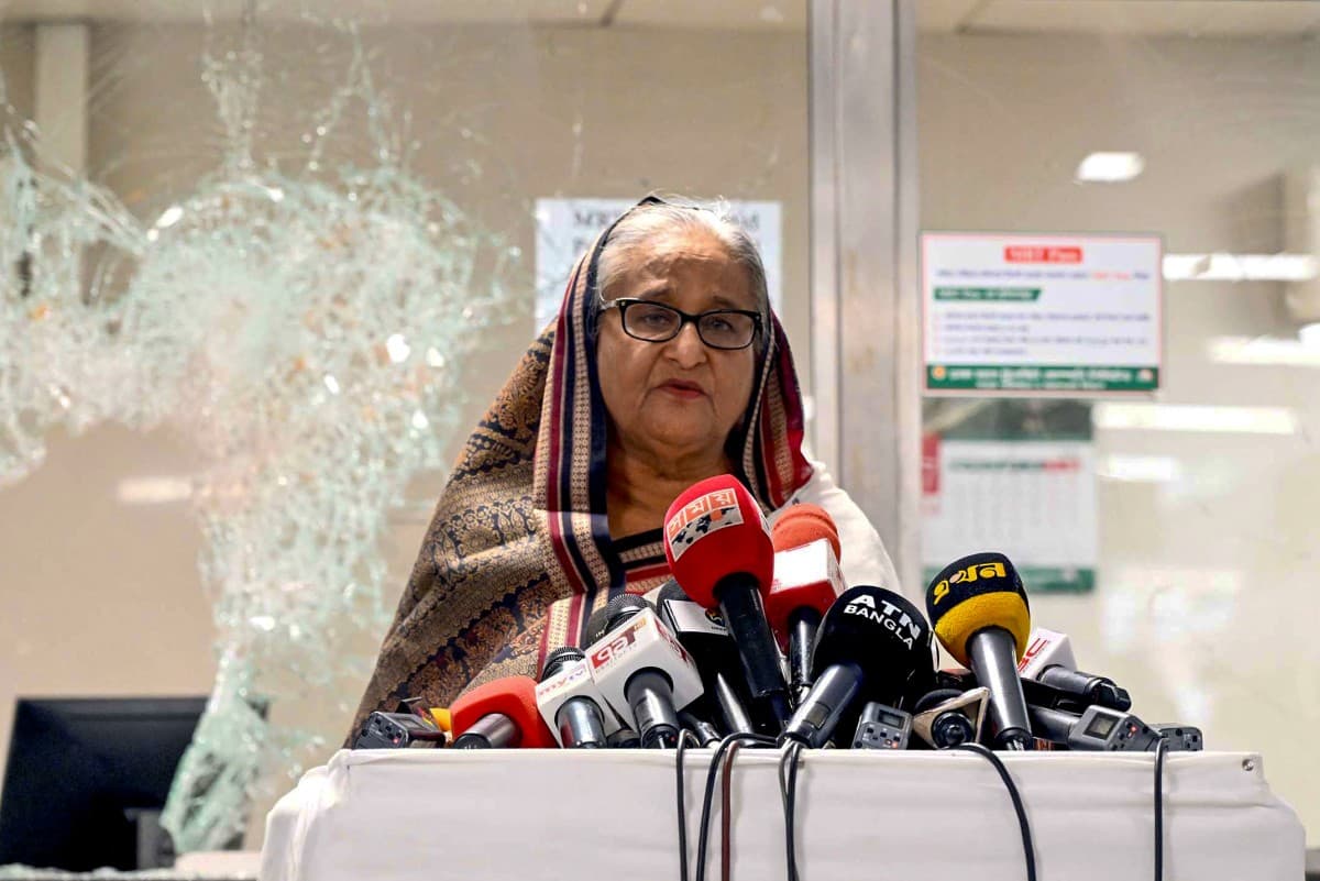 In this handout photograph taken and released on July 25, 2024 by Bangladesh Prime Minister's Office, Prime Minister Sheikh Hasina addresses the media at a vandalized metro station in Mirpur, after the anti-quota protests. -- Photo by AFP/File