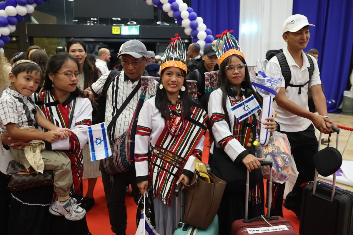 Members of the Bnei Menashe (Sons of Manasseh) community in India arrive at Ben Gurion Airport in Lod, near Tel Aviv, on April 23, 2026, as part of Operation Wings of Dawn. (AFP)