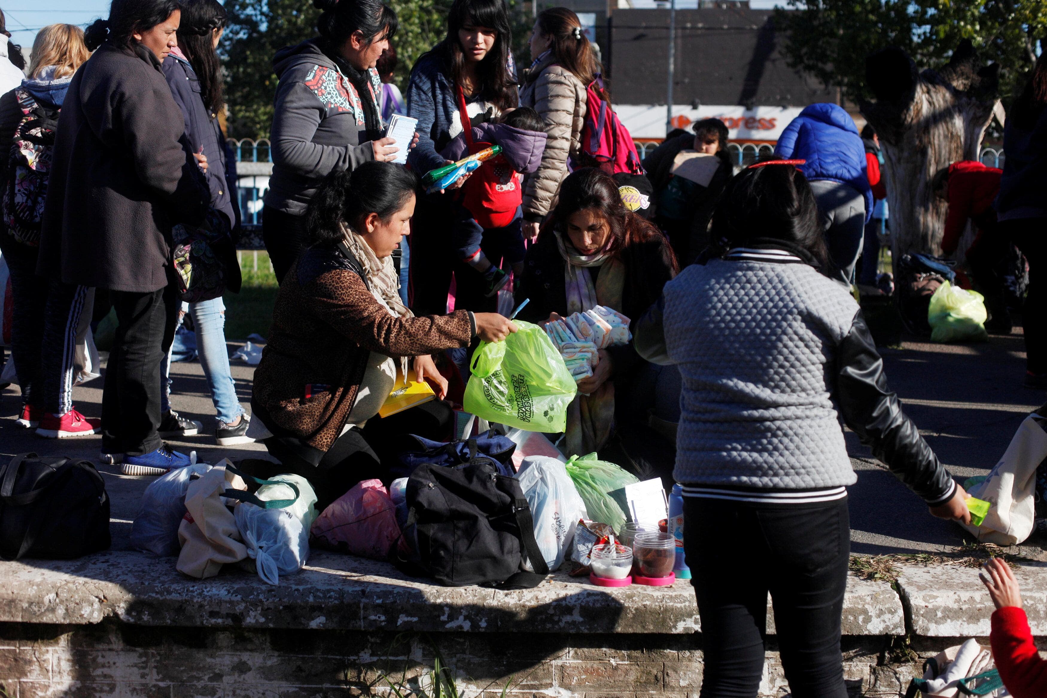 People barter goods in San Miguel market, on the outskirts of Buenos Aires, Argentina. (REUTERS)