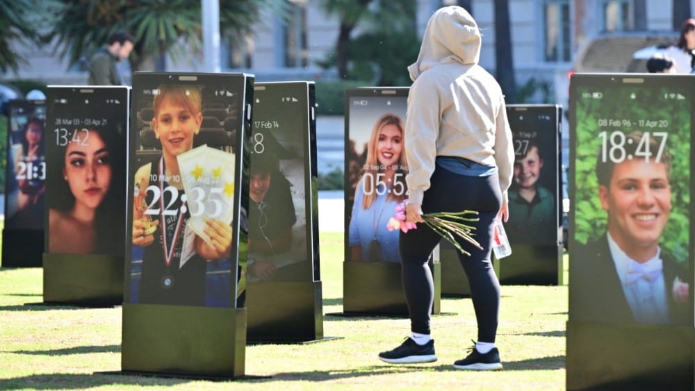 Images of deceased children are displayed at the 'Lost Screen Memorial', an art installation of large-scale smartphones featuring 50 children who lost their lives due to online harm, in Los Angeles, California on February 13, 2026. (Photo: AFP)