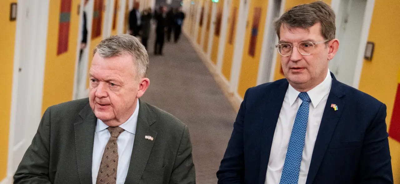 Danish Defense Minister Troels Lund Poulsen (R) and Danish Foreign Minister Lars Loekke Rasmussen hold a doorstep after a meeting with the Parliamentary Foreign Policy Committee at Christiansborg in Copenhagen, Denmark, on January 13, 2026.