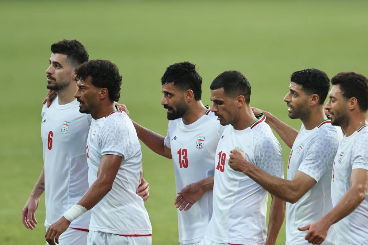 Iran's Forward #23 Ramin Rezaeian celebrates with teammates after scoring their side's second goal during an international friendly football match between Iran and Gambia, in Antalya, southern Turkey, May 29, 2026, as part of Iran's preparation for the up