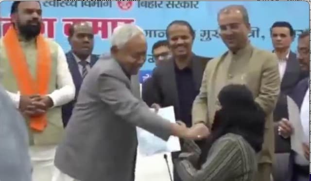 Indian chief minister faces backlash over removing Muslim woman’s veil