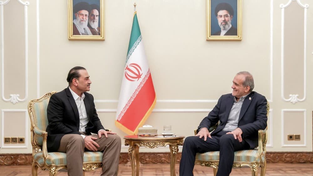 President Masoud Pezeshkian (R) receives Pakistan's army chief Syed Asim Munir (L) in Tehran on August 24, 2026. (Photo by Iranian Presidency / AFP)
