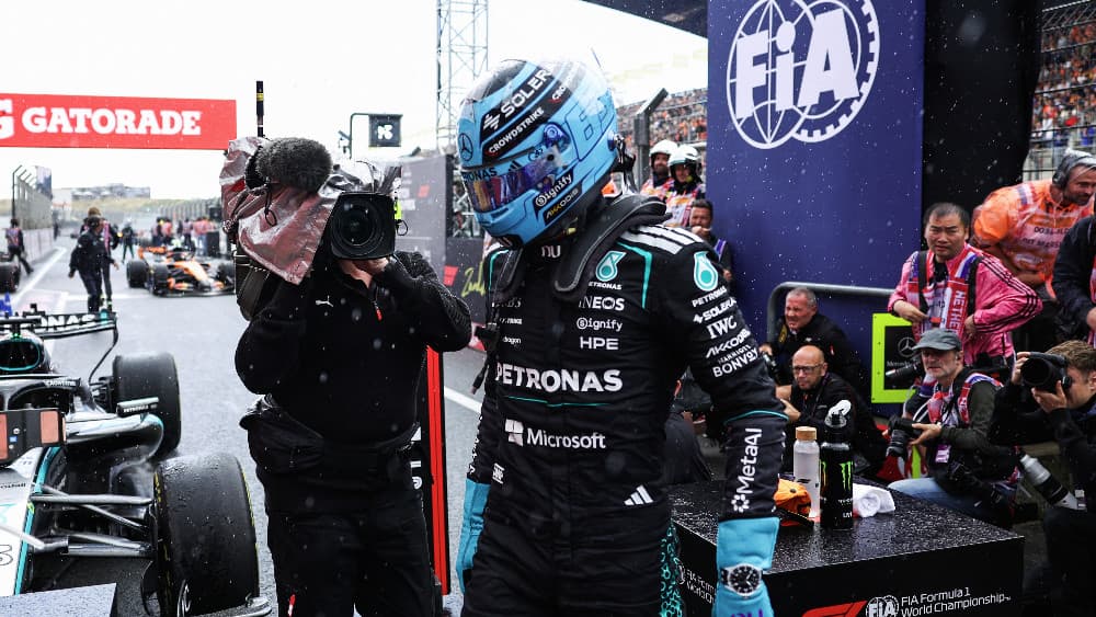 Mercedes' British driver George Russell celebrates after winning the sprint race ahead of the Formula One Dutch Grand Prix at The Circuit Zandvoort, western Netherlands, on August 22, 2026. (AFP)