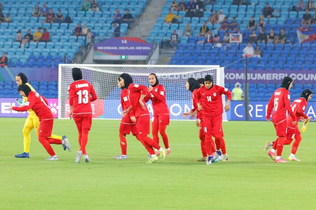 This photo taken on March 8, 2026 shows Iranian players running towards their positions at the start of the AFC Women’s Asian Cup Australia 2026 football match between Iran and the Philippines on the Gold Coast. (AFP)
