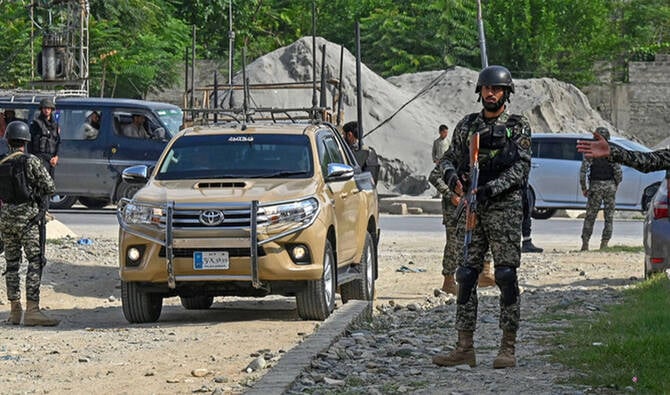 Security personnel stand guard at the site of a bomb blast in Bajaur district of Khyber-Pakhtunkhwa province on July 31, 2023. (AFP/File)