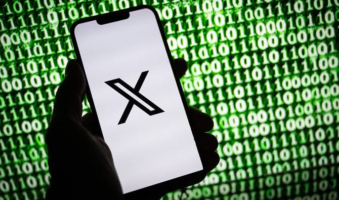 This illustration photograph taken on October 30, 2023, shows the X (former Twitter) logo on a smartphone in Mulhouse, eastern France. (AFP/File)