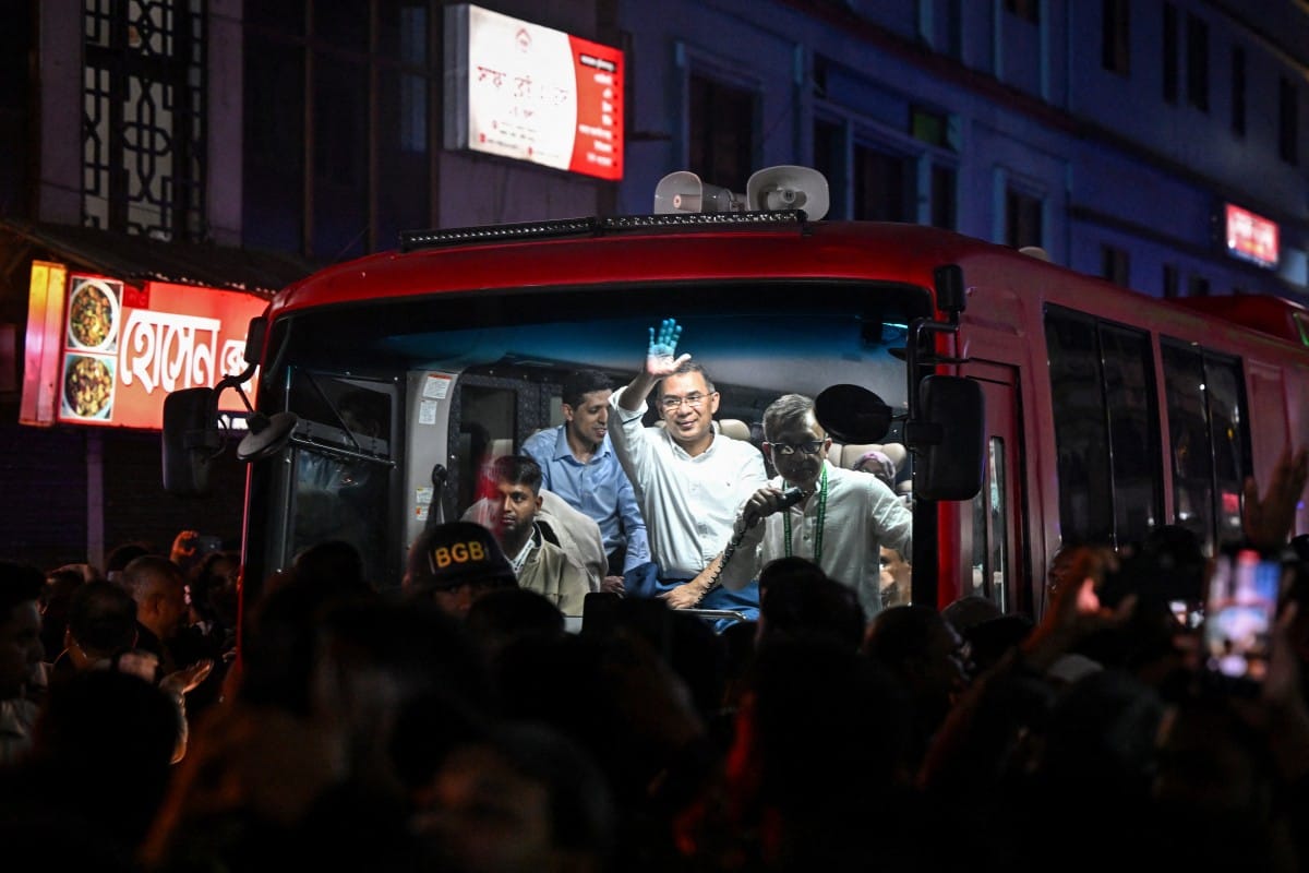 TOPSHOT - Bangladesh Nationalist Party (BNP) chairman Tarique Rahman waves to supporters from a vehicle after visiting the shrine of Sufi saint Hazrat Shahjalal in Sylhet on January 21, 2026, as part of the official launch of his election campaign. (AFP)