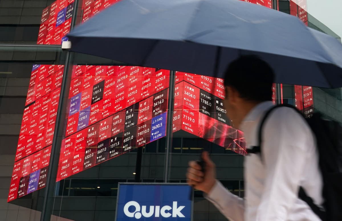A man looks at an electronic quotation board displaying the Nikkei 225 stock prices on the Tokyo Stock Exchange in Tokyo on June 15, 2026. (Photo: AFP)