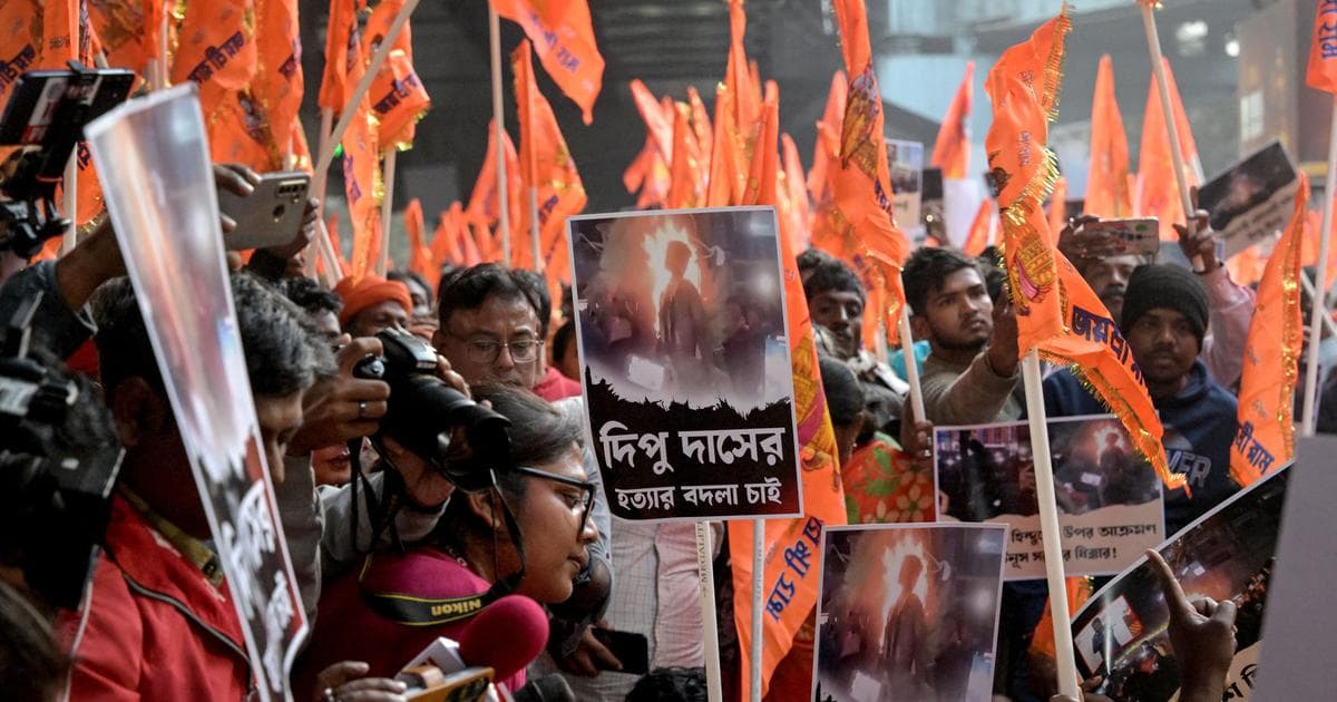 Bharatiya Janata Party (BJP) and religious activists protest near the Deputy High Commission of Bangladesh office in Kolkata on December 22, 2025 (AFP)