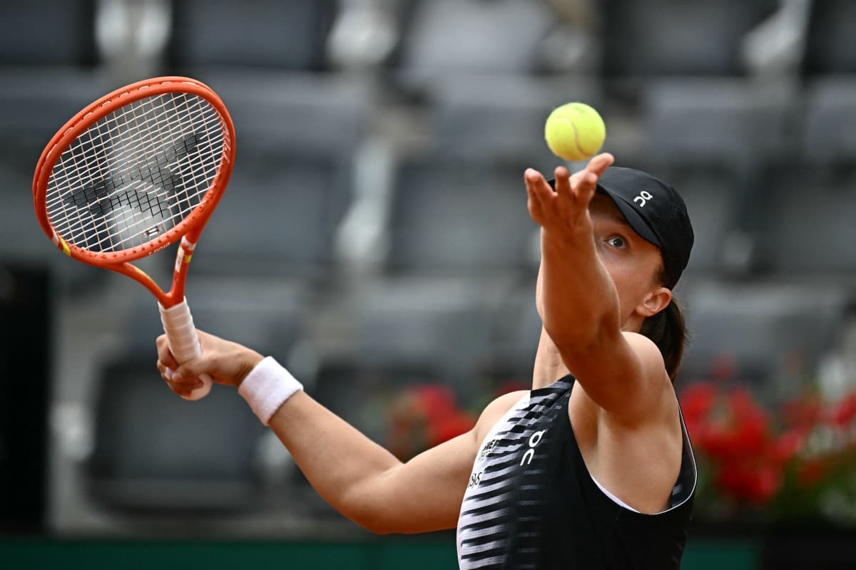 Poland's Iga Swiatek serves to US Caty McNally during their women's singles match of the WTA Rome Open tennis tournament at the Foro Italico in Rome on May 8, 2026. (AFP)