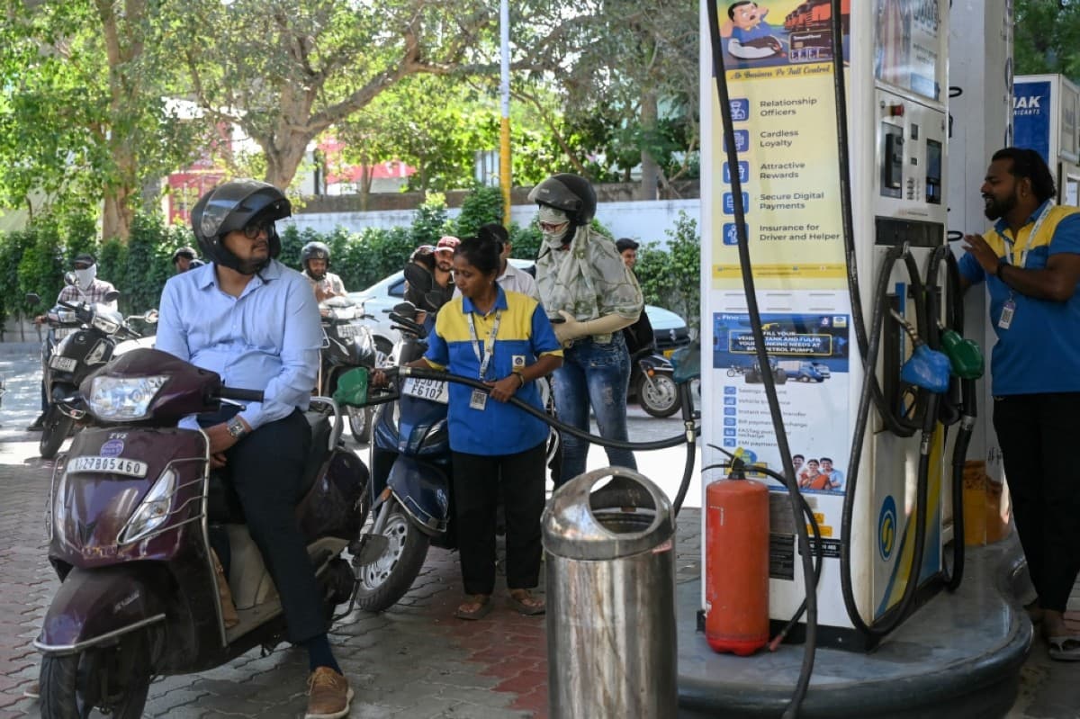 File: A staff worker fills petrol in a scooter at a fuel station in Ahmedabad on May 15, 2026. (AFP)