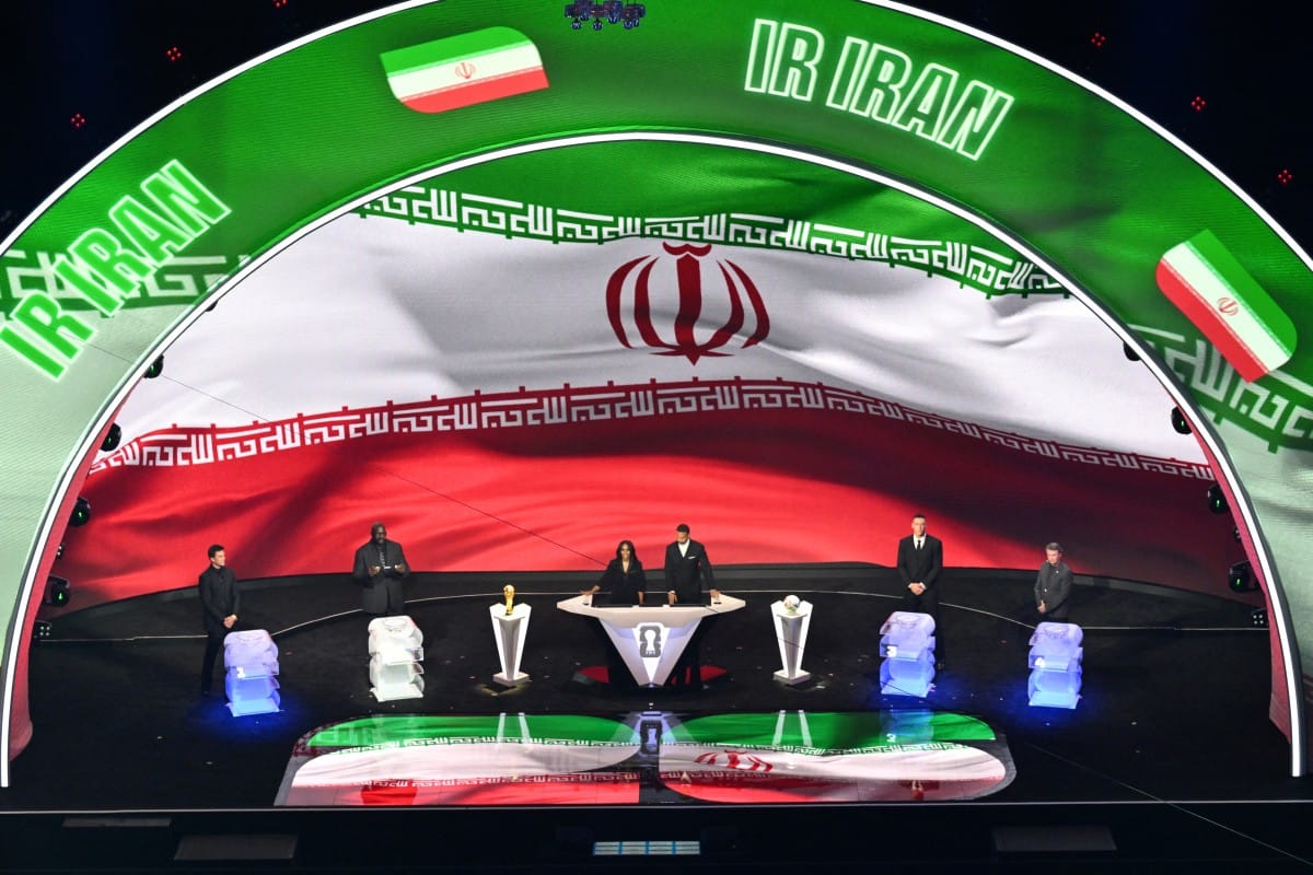 Iran's flag is displayed on a screen during the draw for the 2026 FIFA Football World Cup taking place in the US, Canada and Mexico, at the Kennedy Center, in Washington, DC, on December 5, 2025. (AFP)