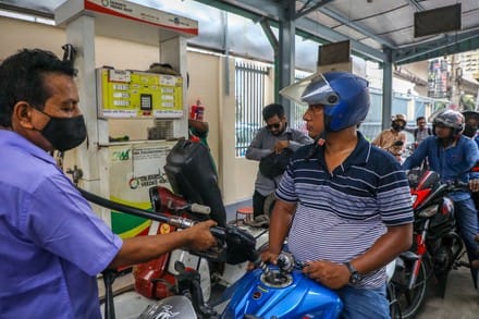 Fuel droplets fall from a nozzle at a gasoline station in Dhaka, Bangladesh on August 6, 2022. (AFP)