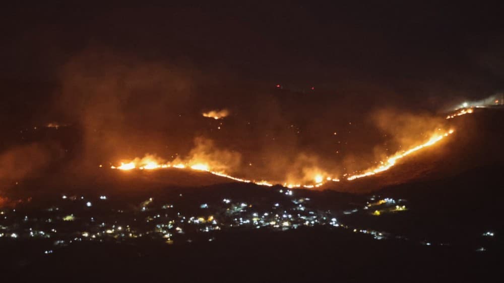 Forest fires sweep through the outskirts of the southern village of Kfar Shouba as a result of Israeli shelling that targeted the area, as seen from the southern Lebanese area of Marjayoun on August 5, 2026. (File photo: AFP)