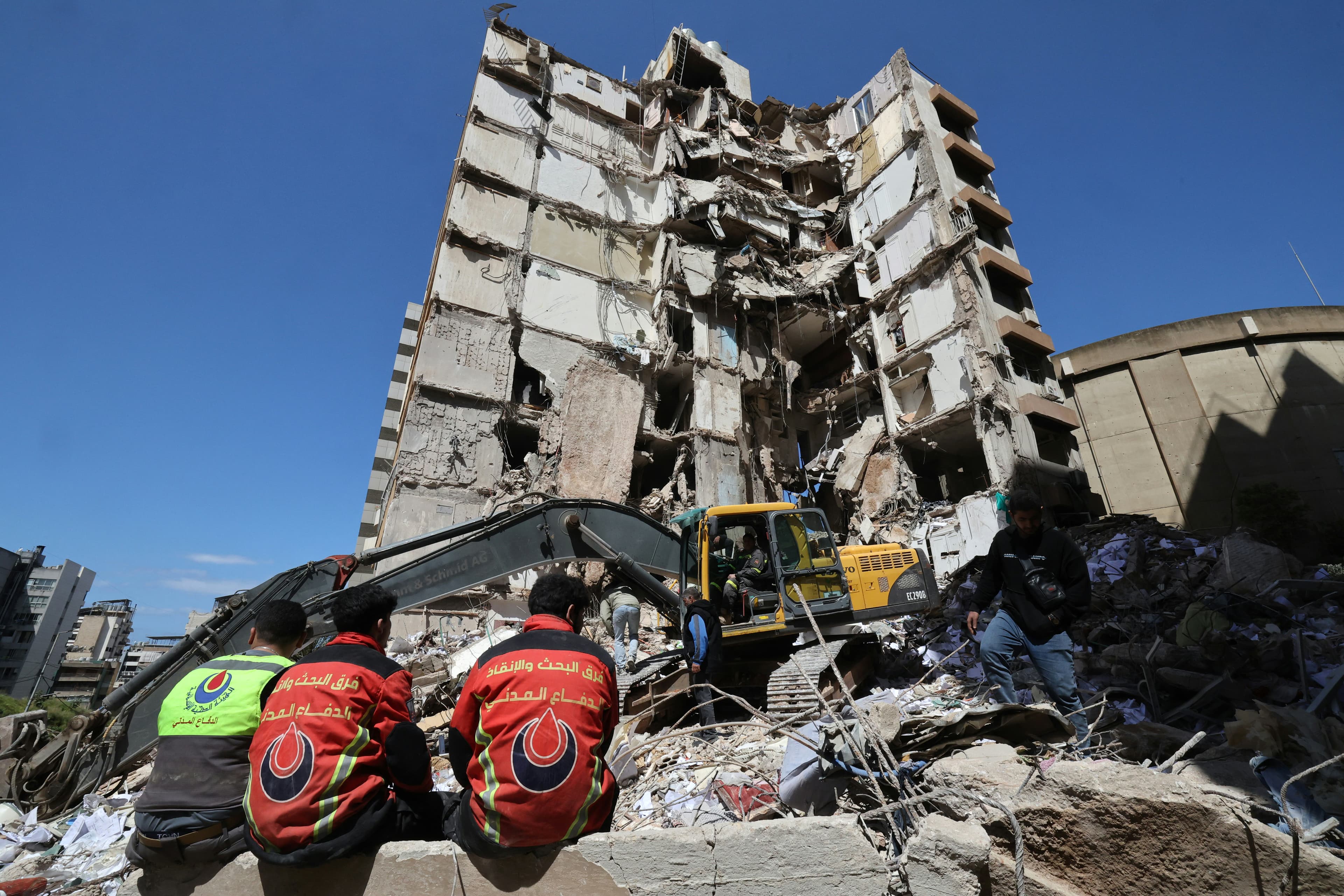 Lebanese rescuers clear the rubble at the site of an Israeli airstrike that targeted a building the day before in the Lebanese Beirut on April 9, 2026. (AFP)