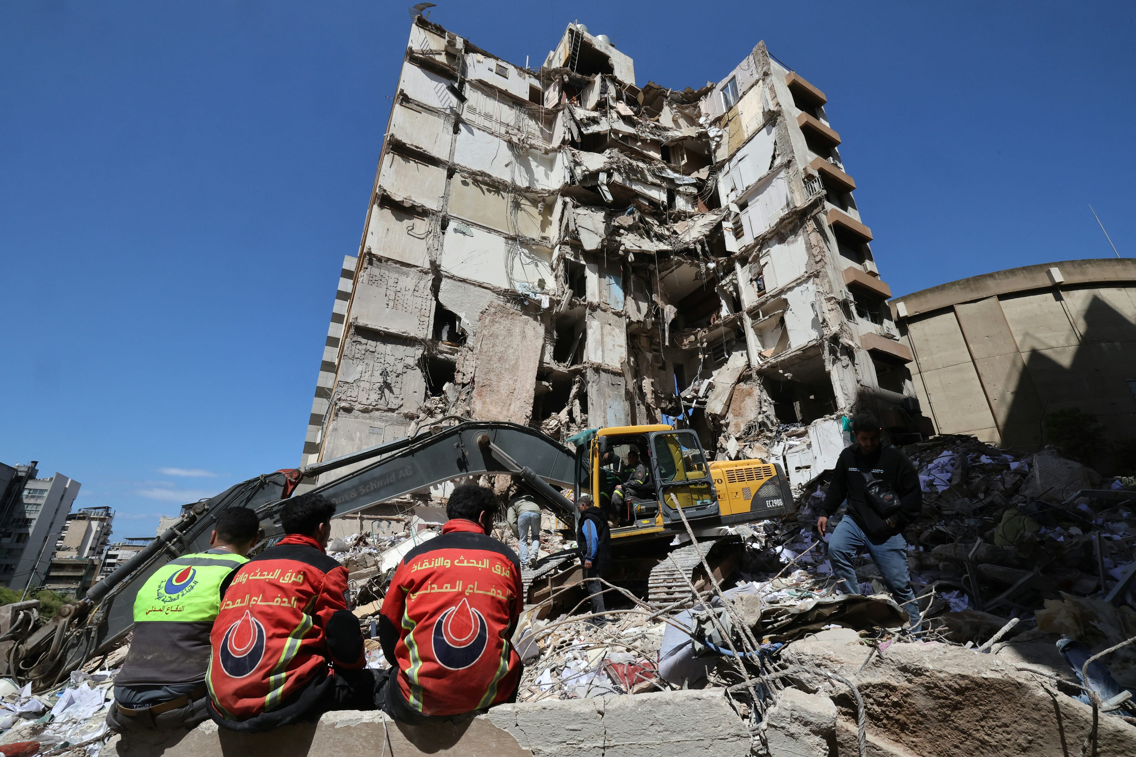 Lebanese rescuers clear the rubble at the site of an Israeli airstrike that targeted a building the day before in the Lebanese Beirut on April 9, 2026. (AFP)