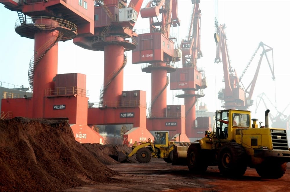 FILE: An excavator loads a truck with rare earth at the Port of Lianyungang in Lianyungang city, east China's Jiangsu province, 31 October 2010. (AFP)
