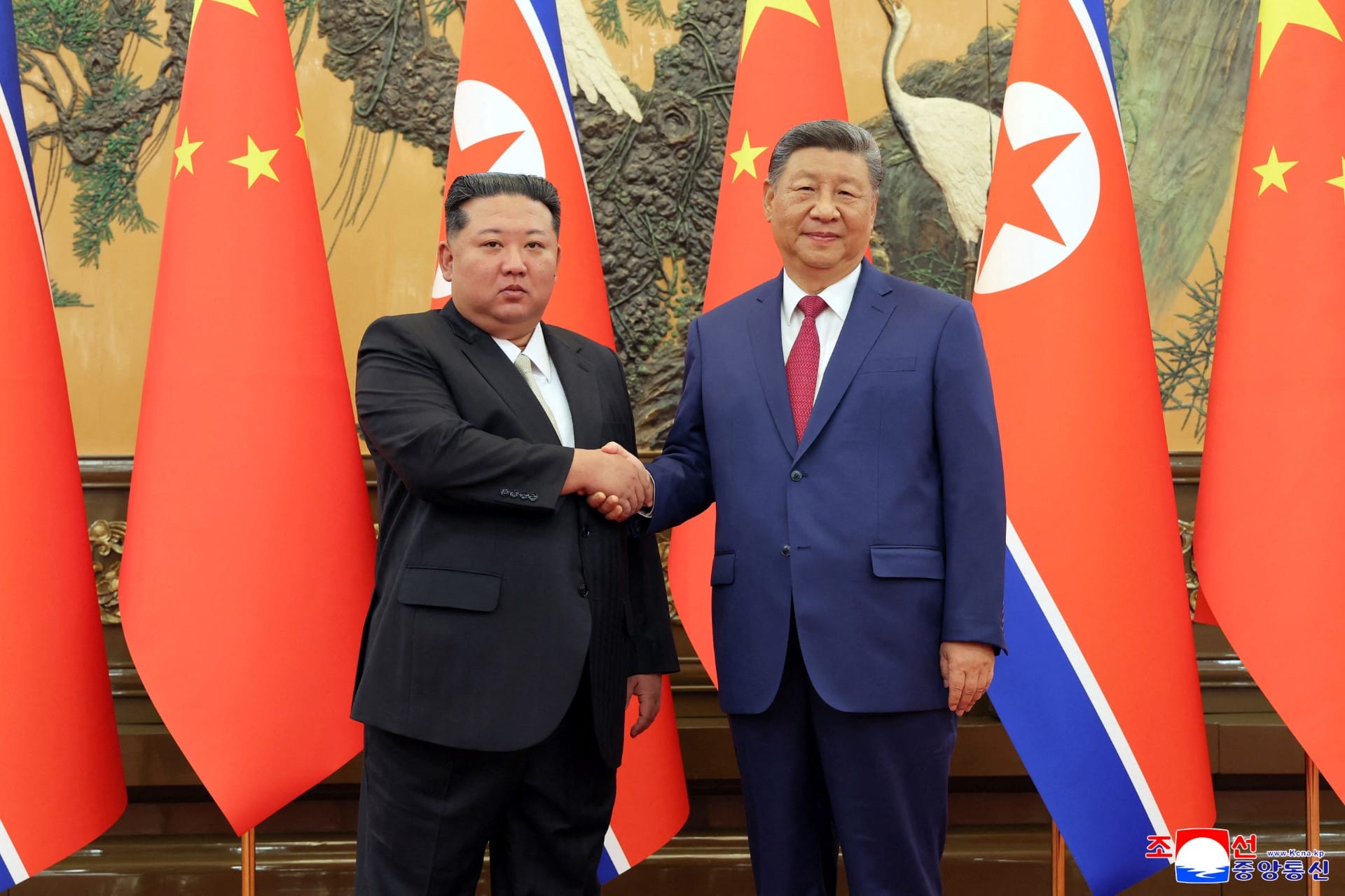 This picture taken on September 4, 2025 and released from North Korea's official Korean Central News Agency (KCNA) on September 5, 2025 shows North Korean leader Kim Jong Un (L) shaking hands with Chinese President Xi Jinping in Beijing. China's leader Xi