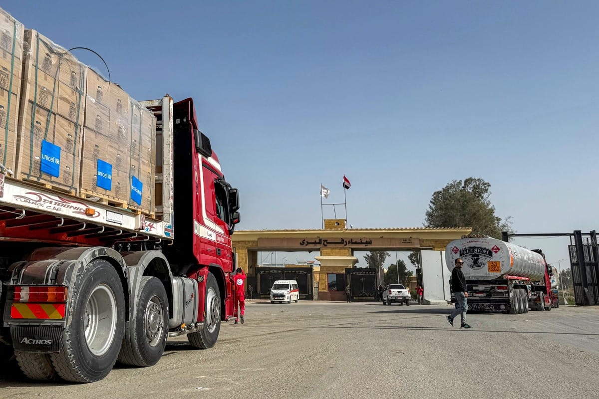 Fuel and humanitarian aid trucks enter through the Egyptian side of the Rafah border crossing with the Gaza Strip in northeastern Egypt on January 27, 2026, as the vital crossing to the Palestinian territory reopens. (AFP)