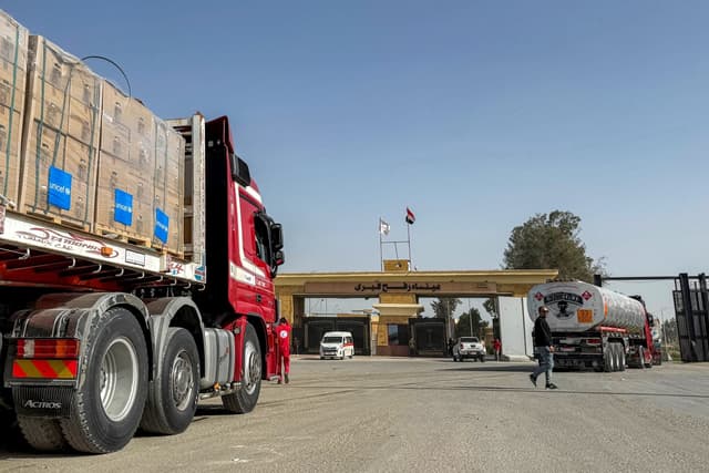 Fuel and humanitarian aid trucks enter through the Egyptian side of the Rafah border crossing with the Gaza Strip in northeastern Egypt on January 27, 2026, as the vital crossing to the Palestinian territory reopens. (AFP)