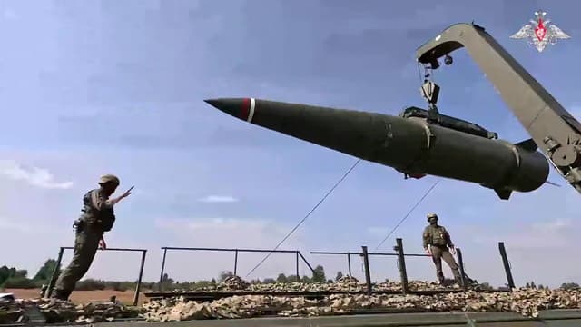 Russian troops load an Iskander missile