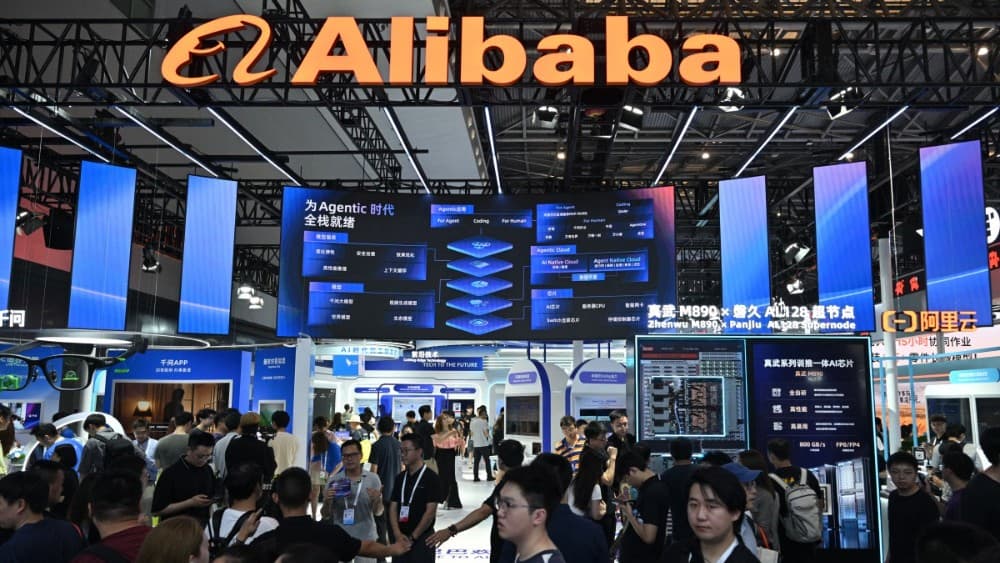 People visit the Alibaba booth during the World Artificial Intelligence Conference (WAIC) in Shanghai on July 18, 2026. (Photo by Hector RETAMAL / AFP)
