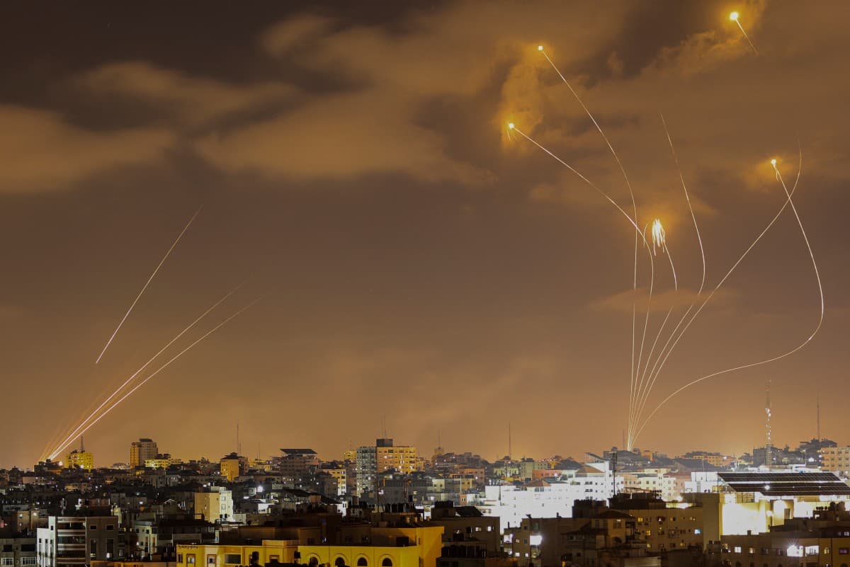 Israel's Iron Dome air defence system (R) intercepts rockets (L) launched from Gaza City on May 13, 2023. (File photo: AFP)