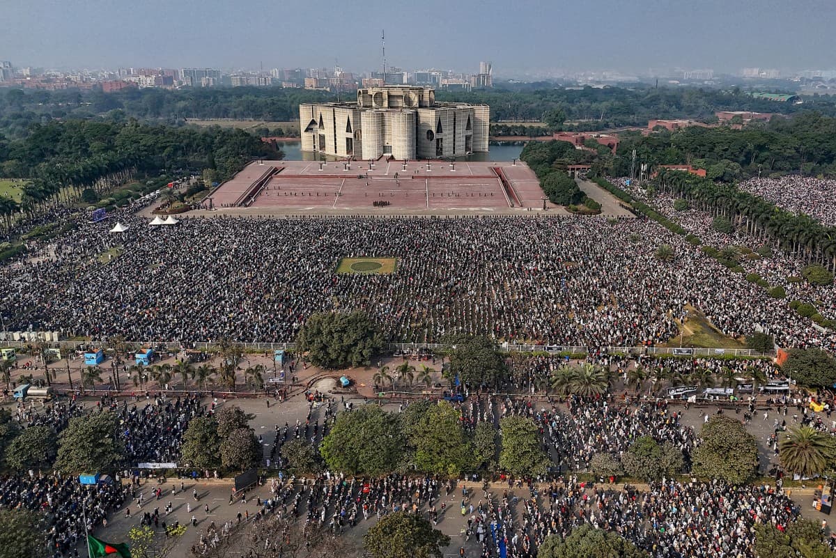 An aerial view shows mourners gathered for the funeral ceremony of Bangladesh's former prime minister Khaleda Zia at the Parliament House premises in Dhaka on December 31, 2025 a day after her death. Bangladesh bid farewell on December 31 to Zia, the firs