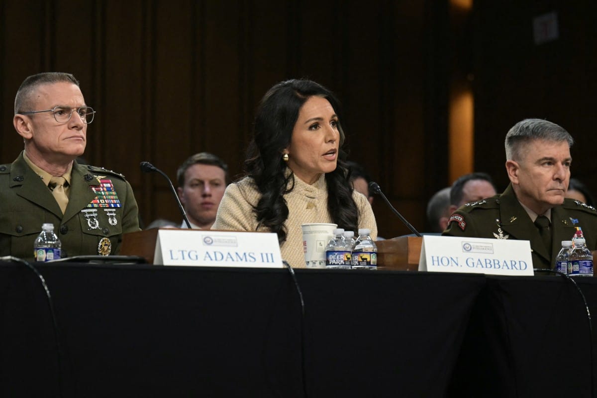 (L/R) Director of Defense Intelligence Agency (DIA) James Adams III, US Director of National Intelligence Tulsi Gabbard, acting commander of US Cyber Command William Hartman testify during a Senate Committee on Intelligence hearing to examine worldwide th