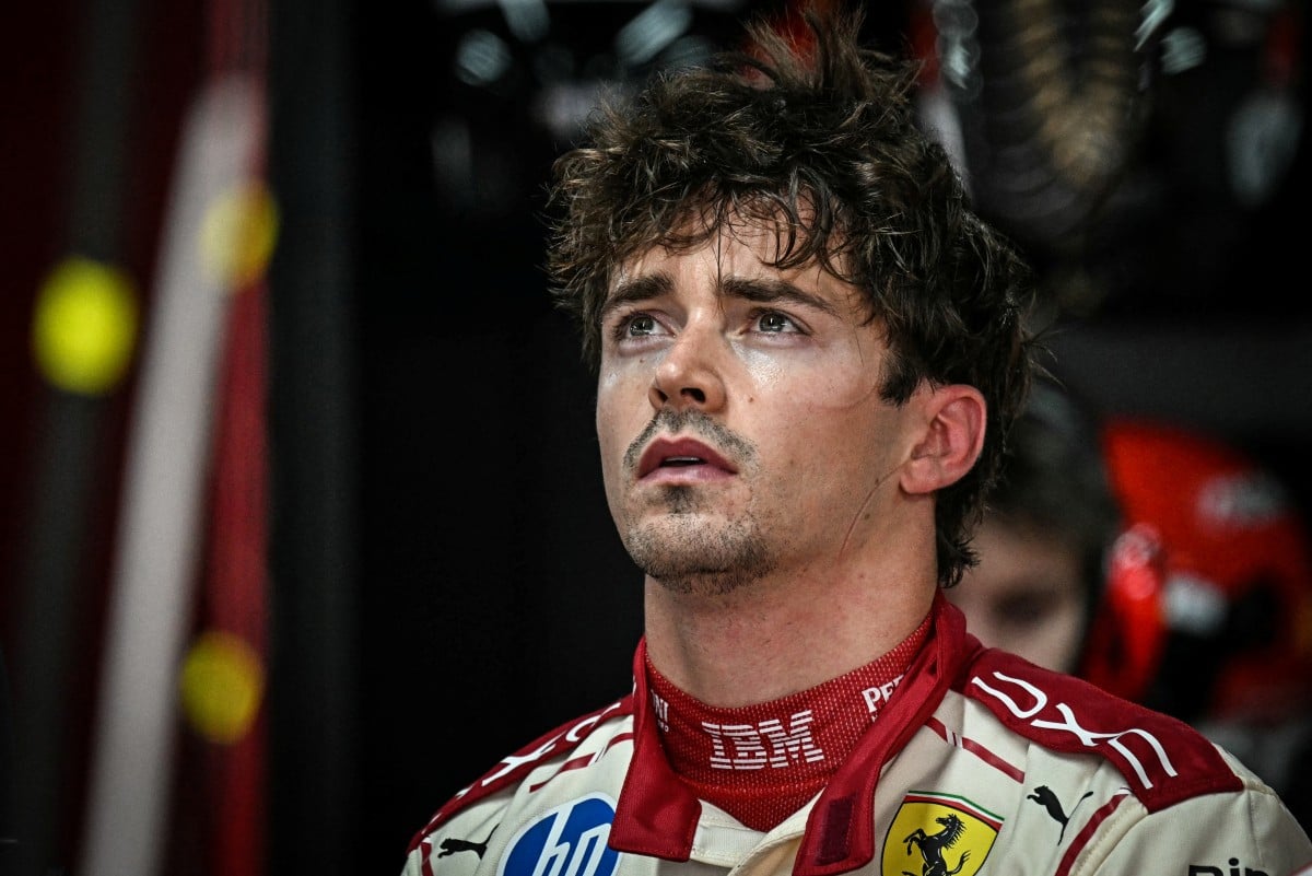 Ferrari's Monegasque driver Charles Leclerc reacts in the garage as he looks at the results after taking part in the first practice session at the Monaco street circuit in Monaco, ahead of the Monaco Formula 1 Grand Prix, on June 5, 2026. (Photo by Gabrie