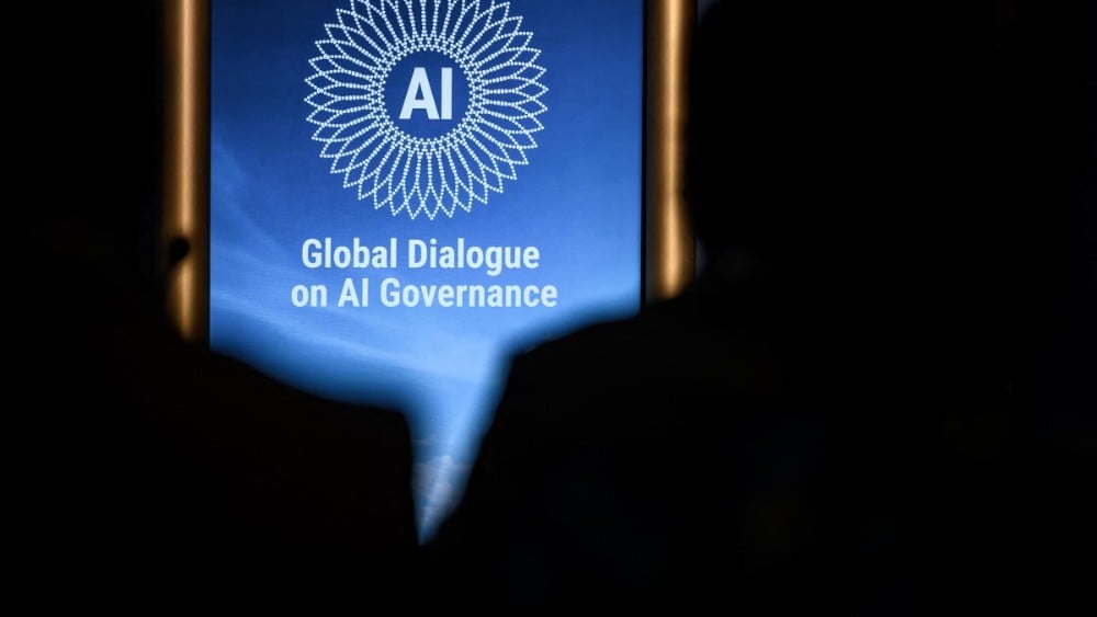 This photograph shows the logo of the first Global Dialogue on AI Governance displayed in Geneva on July 6, 2026.