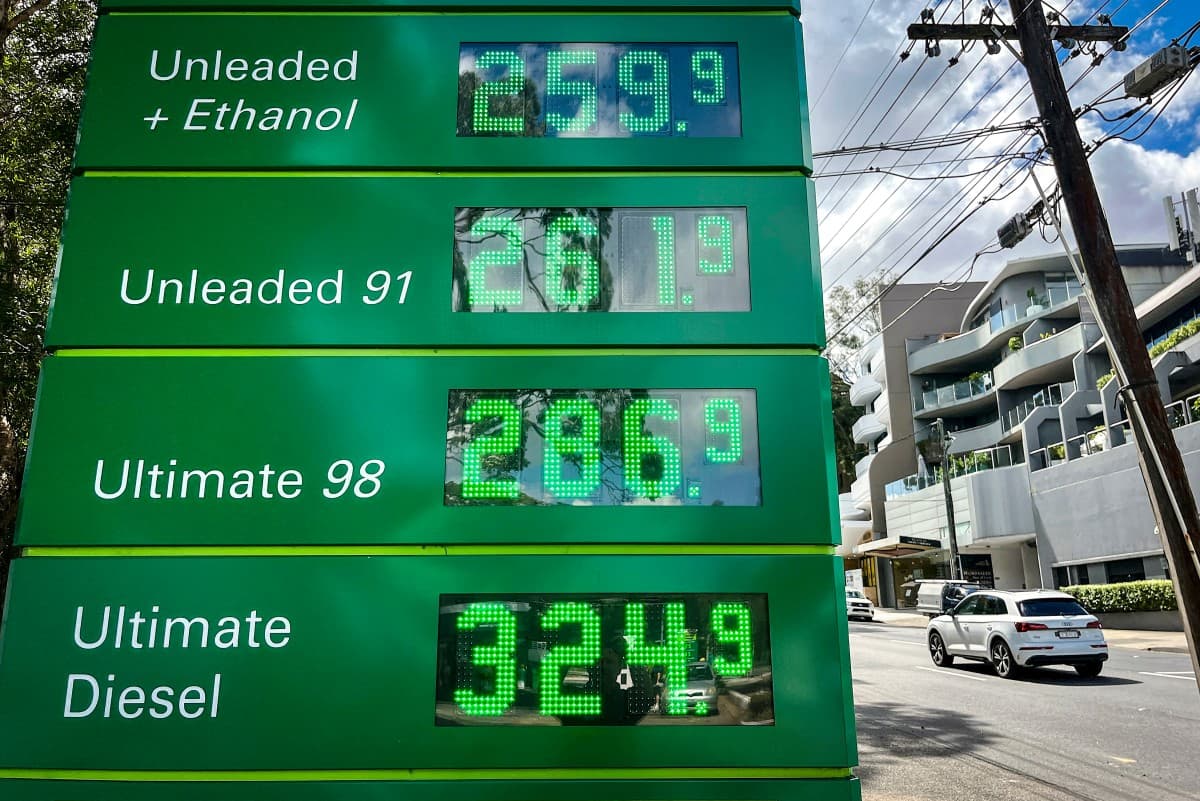 A car passes a sign displaying petrol prices at a petrol station in Sydney on March 30, 2026.