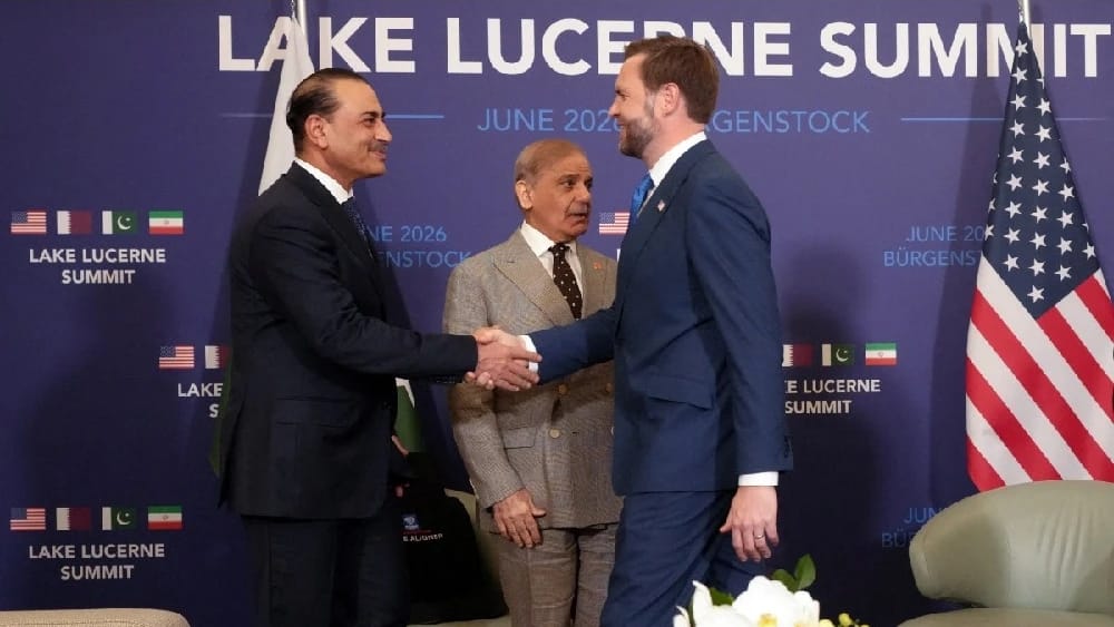 US Vice President JD Vance (R) shakes hands with Pakistan's Chief of Army Staff Field Marshal Asim Munir next to Pakistan's Prime Minister Shehbaz Sharif at the Burgenstock luxury hotel complex overlooking Lake Lucerne, Switzerland, on June 21, 2026. (Fil