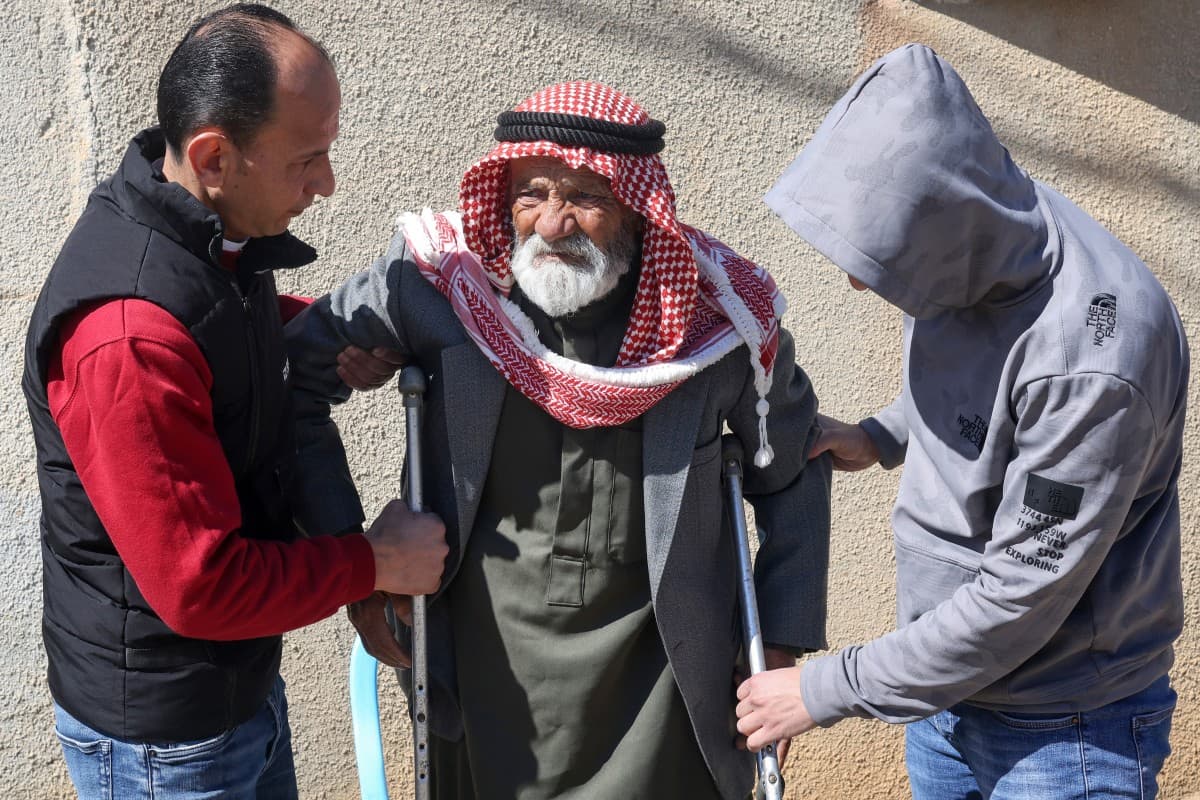 The father (C) of Palestinian brothers Mohammed and Faheem Muammar, who were killed the previous day reportedly by Israeli settlers, is assisted during their funeral in the village of Qaryut south of Nablus in the occupied West Bank on March 3, 2026. (AFP