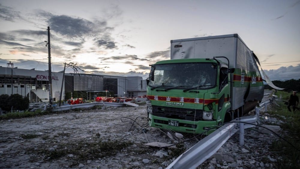 A damaged truck is seen on a debris-covered road following an explosion at the Aeon Mall Kumamoto in Kashima, Kumamoto Prefecture, on July 29, 2026, after an earthquake struck the area. (Photo: AFP)